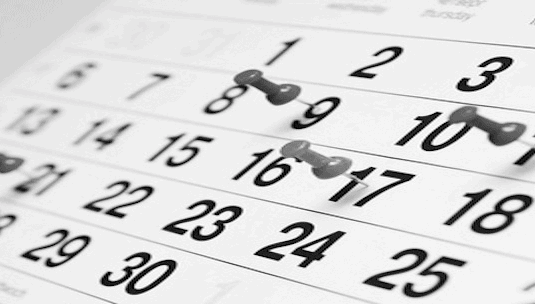 Calendar with marks for important dates related to college registration and deadlines, symbolizing higher education planning and student success.