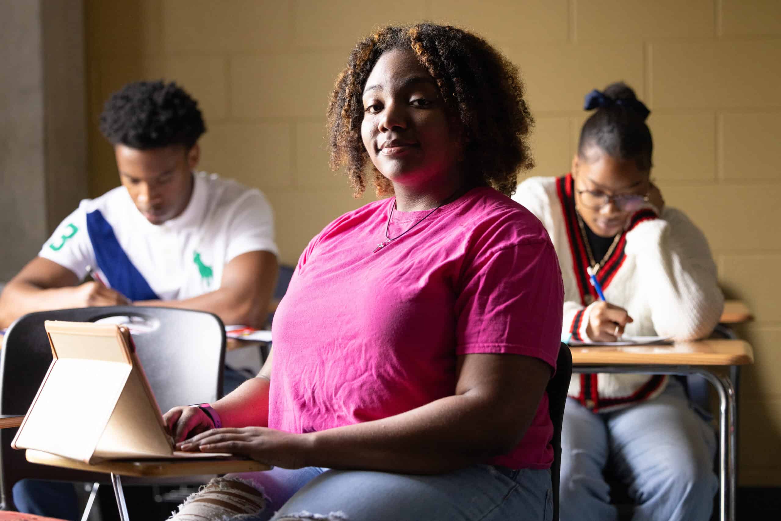 Empowered diverse college students engaging in learning environment, promoting student success and completion, aligned with Complete College America goals.