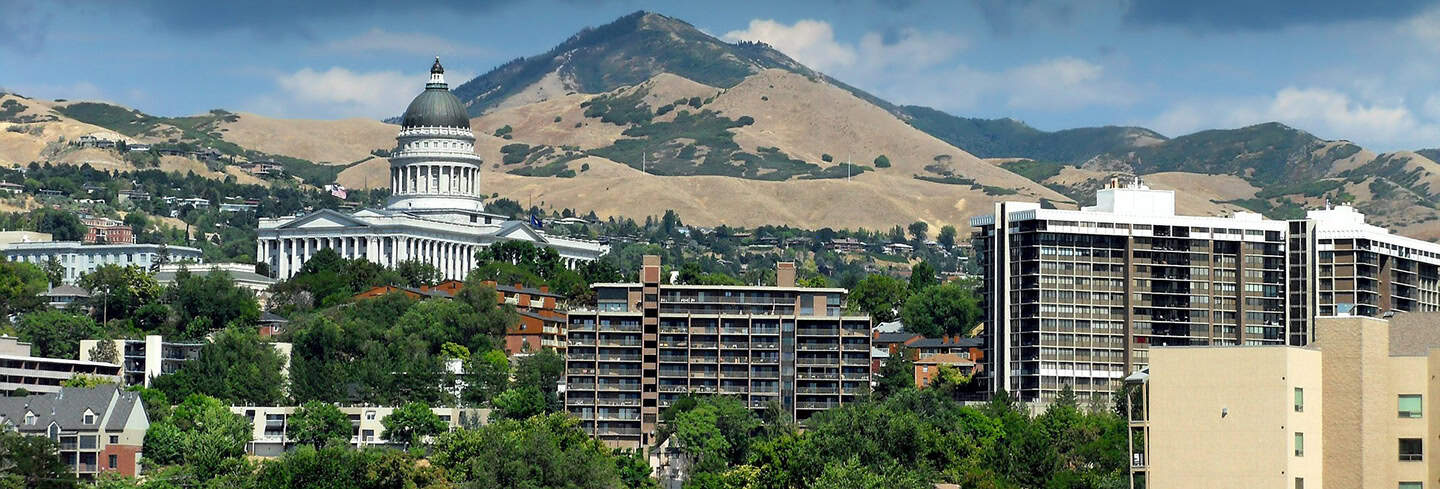 Affordable college education with historic landmarks and rolling hills in the background to inspire student success and community growth.