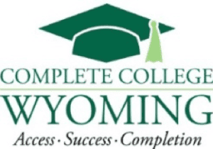 Study of Wyoming college students with graduation cap, mortarboard, and diploma; promoting higher education access and success.
